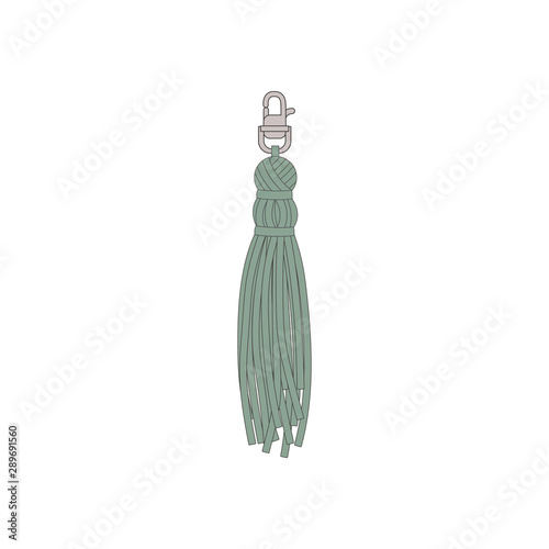 A turquoise tassel with a fringe hangs on a carbine.