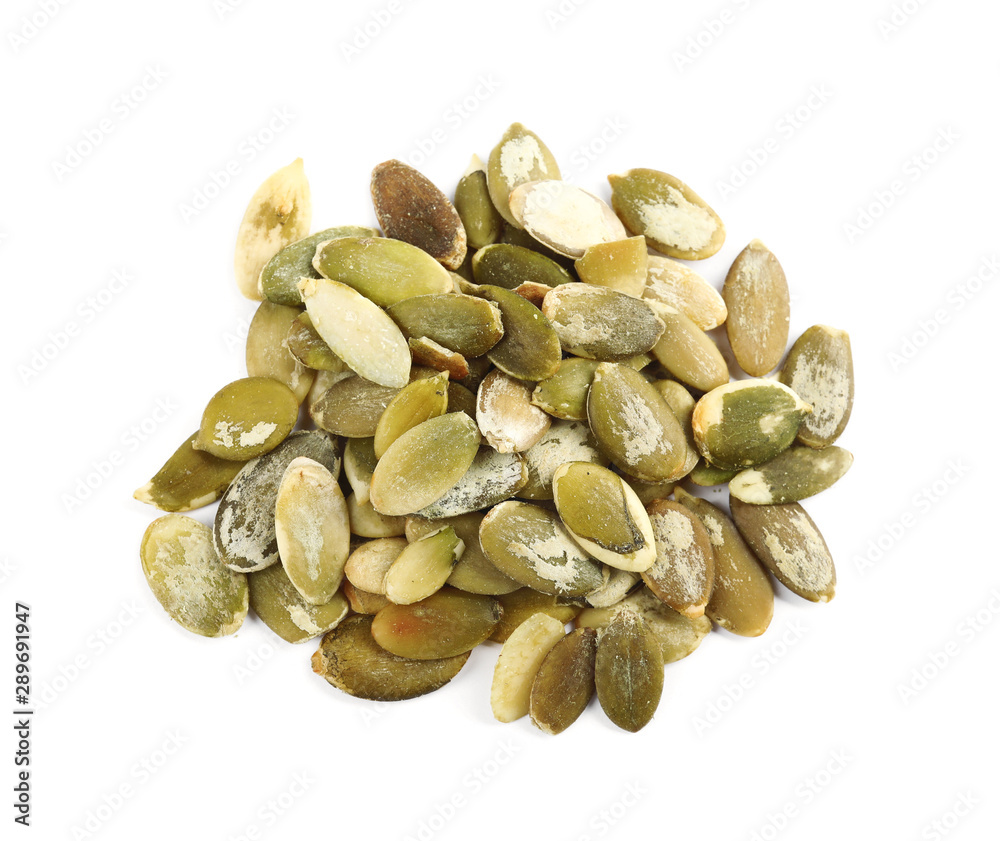 Pile of raw pumpkin seeds on white background, top view Pile of raw pumpkin seeds on white background, top view