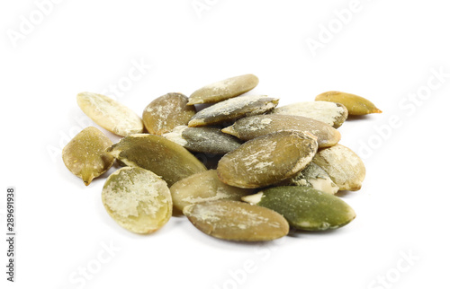 Pile of raw pumpkin seeds on white background