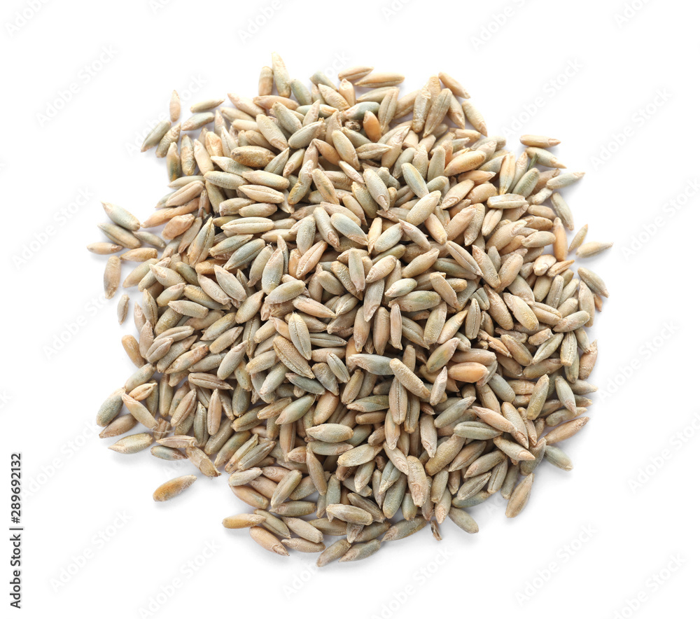 Pile of rye grains on white background, top view. Cereal crop