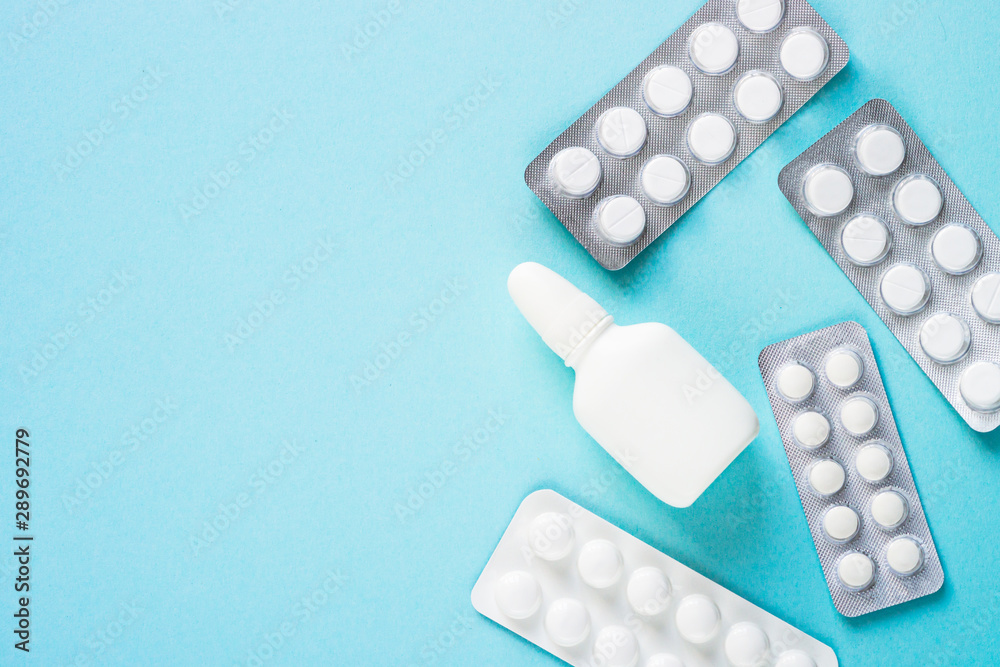 Pills on blue background top view. Pills on blue background top view.