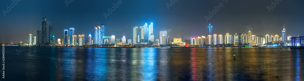 Fototapeta premium At night, the Lighting Show is on the city skyline, Qingdao, China