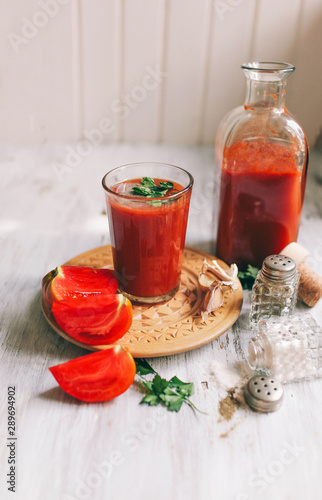 Glass of tomato juice on on a light background Closeup Top view