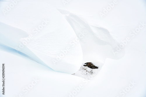 An abstract snowdrift scene in the Lake District mountains, England UK.