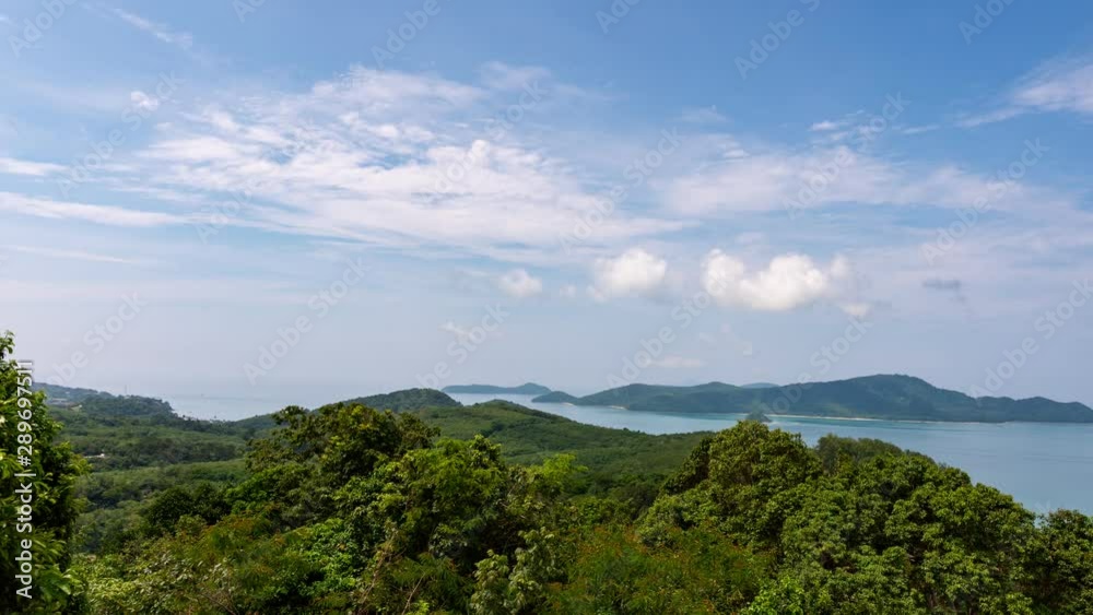 Time lapse of white clouds flowing in the sky over mountain tropical sea in summer season Time lapse of white clouds flowing in the sky over mountain tropical sea in summer season