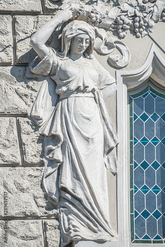 Decorative facade sculpture of a beautiful Renaissance Era woman in Prague, Czech Republic photo