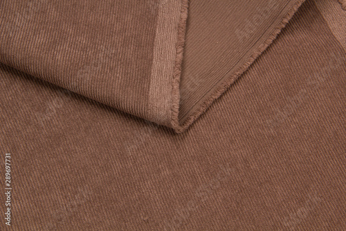 brown ribbed corduroy background. corduroy fabric texture