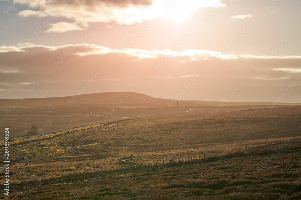 Obraz premium Distant views of the stone chimney's below the summit of Bolts Law in County Durham.