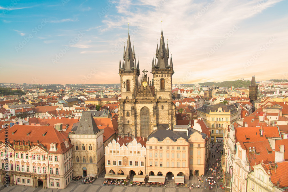 ful view of the Old Town Square, and Tyn Church in Prague, Czech Republic