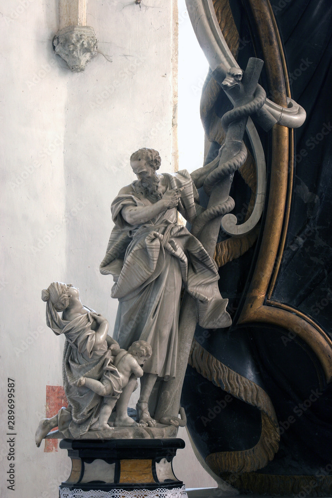Moses lifts up the brass serpent