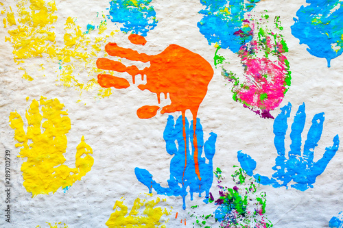 Fototapeta Naklejka Na Ścianę i Meble -  handprints paint on a white wall