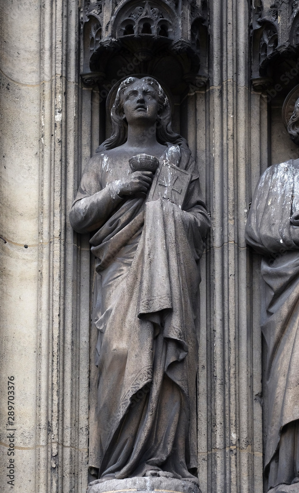 Saint John the Apostle, statue on the portal of the Saint Laurent Church, Paris, France