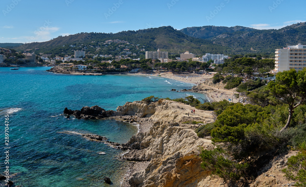Waterside view turquoise sea rocky coastline of Paguera beach, Palma de Mallorca, Spain