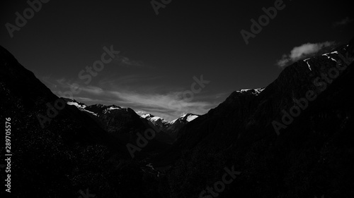 black sunset in mountains