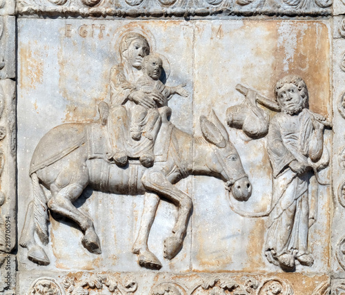 Flight to Egypt  medieval relief on the facade of Basilica of San Zeno in Verona  Italy