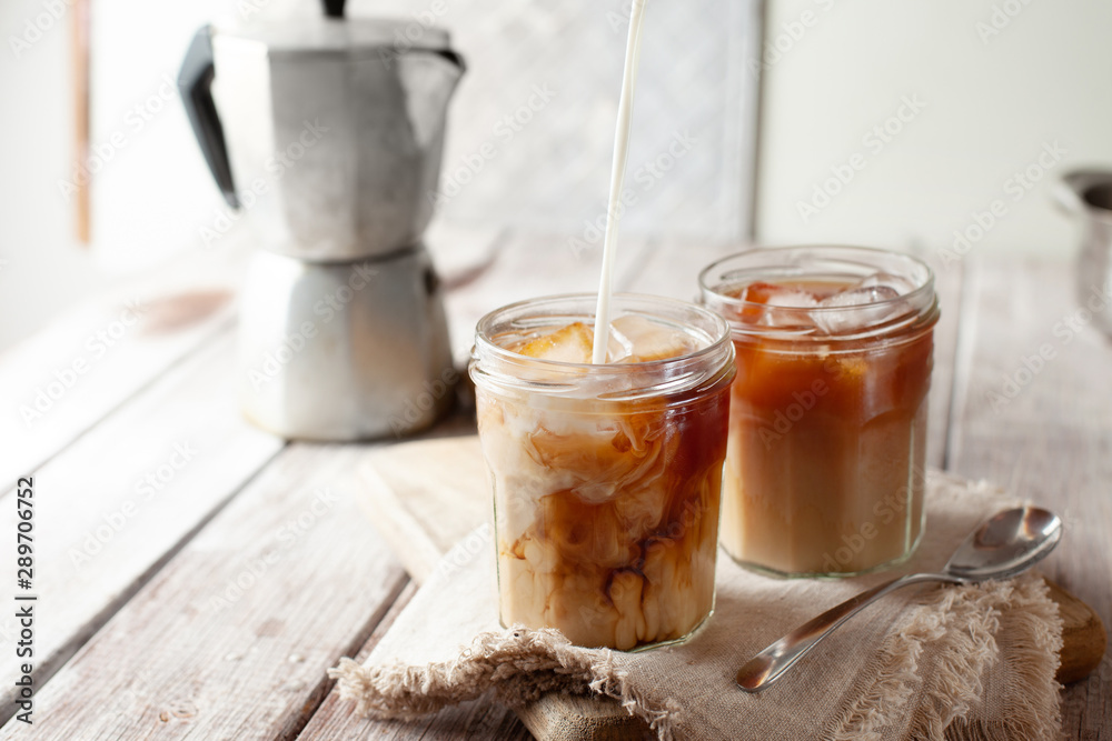 Iced coffee in glasses with cream and ice Iced coffee in glasses with cream and ice