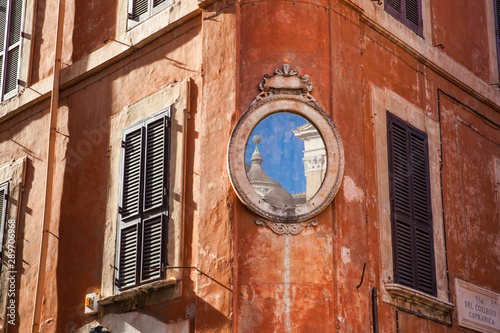 Canvas Print An small piece of the Santa Maria in Aquiro church reflected on a mirror at a co