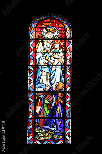 Madonna with child, stained glass, Notre Dame de Clignancourt church, Paris, France photo