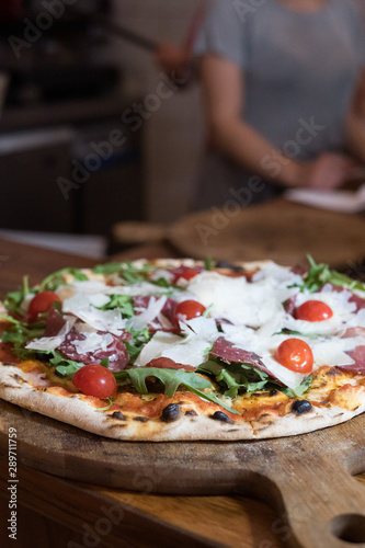 Tasty looking Pizza with fresh Tomatos and Cheese