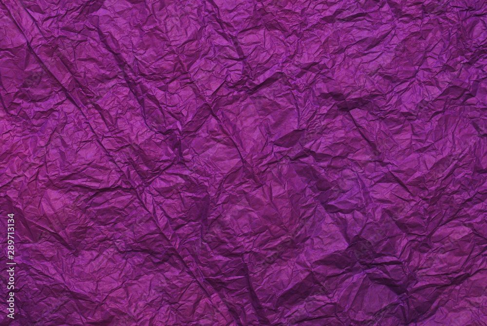Purple crumpled paper texture background. Top view Purple crumpled paper texture background. Top view