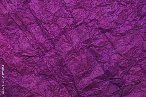 Purple crumpled paper texture background. Top view