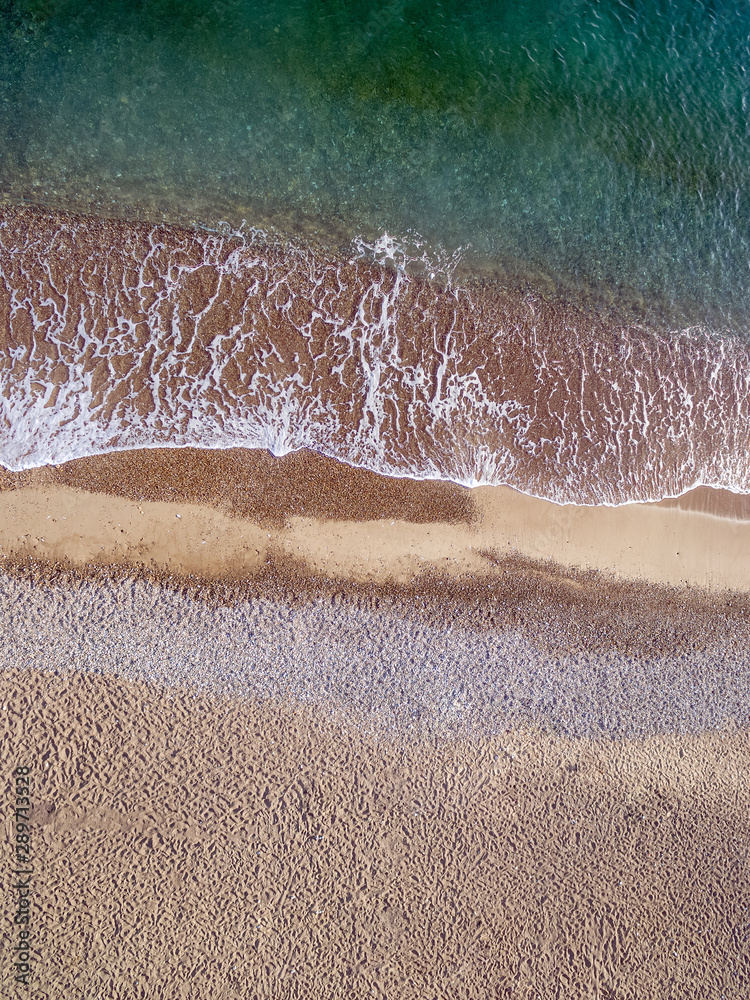 Fototapeta premium Acqua del mare che bagna la sabbia, il bacio