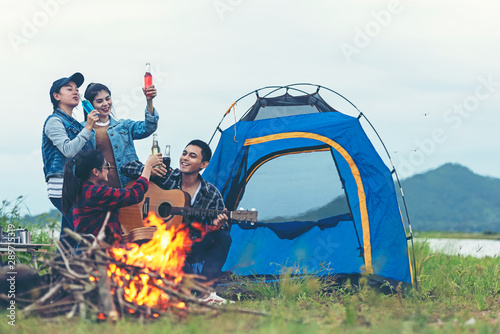 Party Camping.  Group family travel enjoy party and roasted sausages relax in vacations. Campfire at touristic camp at nature in outdoor forest.  Travel Concept