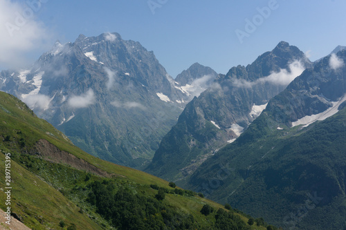 Northern great caucasus mountains near dombay with glaciers and snow in august 2019, original raw picture © Fizzl