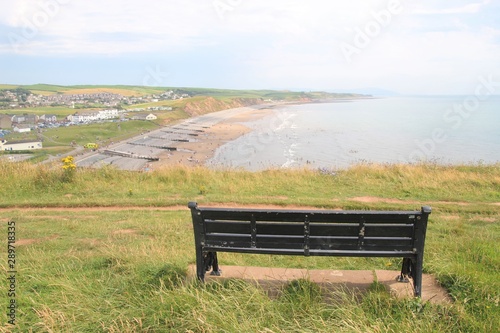 Bench on a hill. From here one has a with magnificent panoramic view of the shore of St Bees. On the west coast of England, near Lake District. North-west Europe. photo