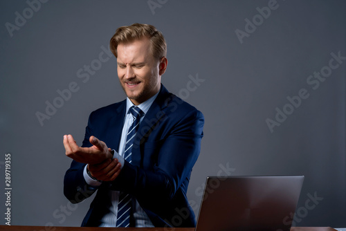 bad feeling woth overwork caucasian businessman hand touch part of body hurt and painful emotion ooffice syndrome ideas concept photo