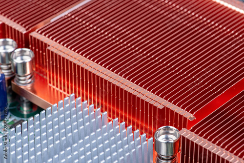 Passive copper and aluminium heat sinks used to cool electronics components photo