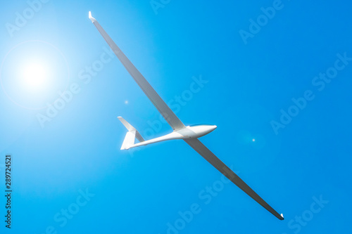 Glider plane flying in a clear sky
