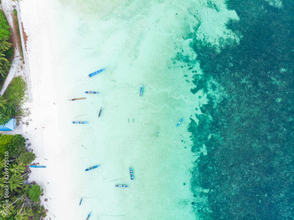 Aerial top down view boat tropical beach caribbean sea at Pasir Panjang. Indonesia Moluccas archipelago, Kei Islands, Banda Sea.