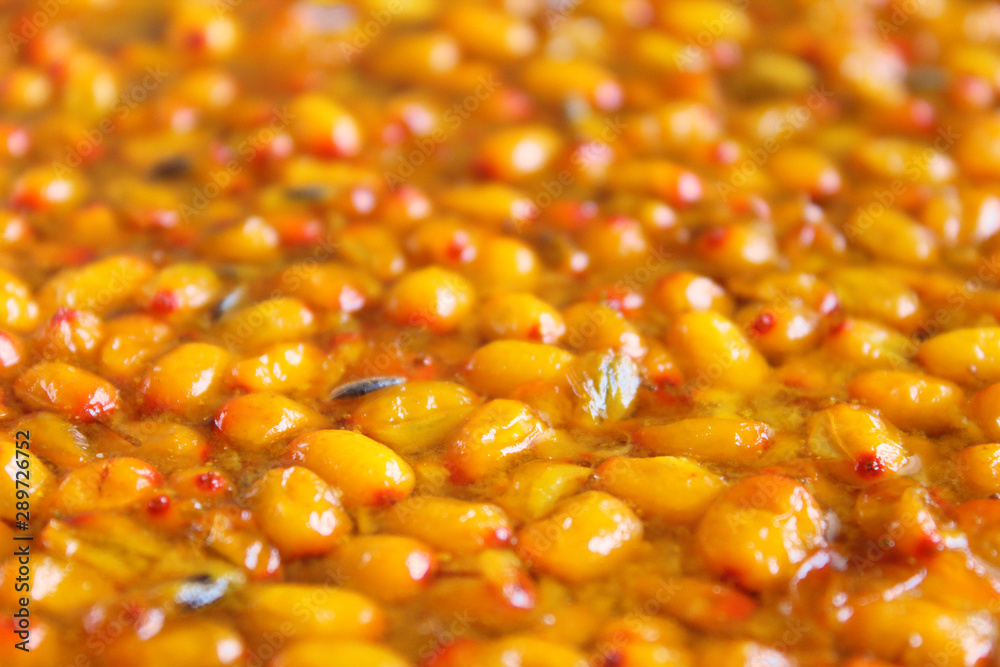 Fresh sea buckthorn jam. Close-up. Background. Texture. Fresh sea buckthorn jam. Close-up. Background. Texture.