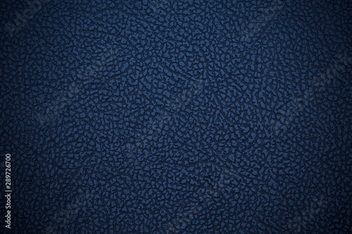 Old blue dark faux leather. Leatherette. Close-up. Background. Texture.