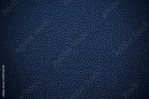 Old blue dark faux leather. Leatherette. Close-up. Background. Texture.