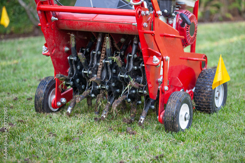 Red grass lawn aerator