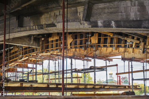 Wooden formwork with scaffolding for the construction of a bridge. © Vitaliy