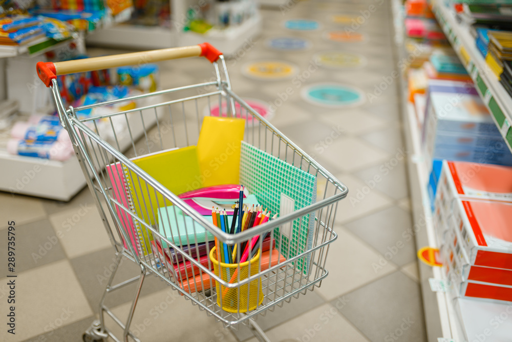 Cart with office supplies in stationery store Cart with office supplies in stationery store