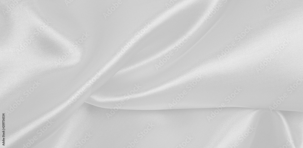 Fototapeta premium Smooth elegant white silk or satin luxury cloth texture as wedding background. Luxurious background design
