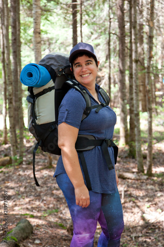 Smiling woman with hiking gear