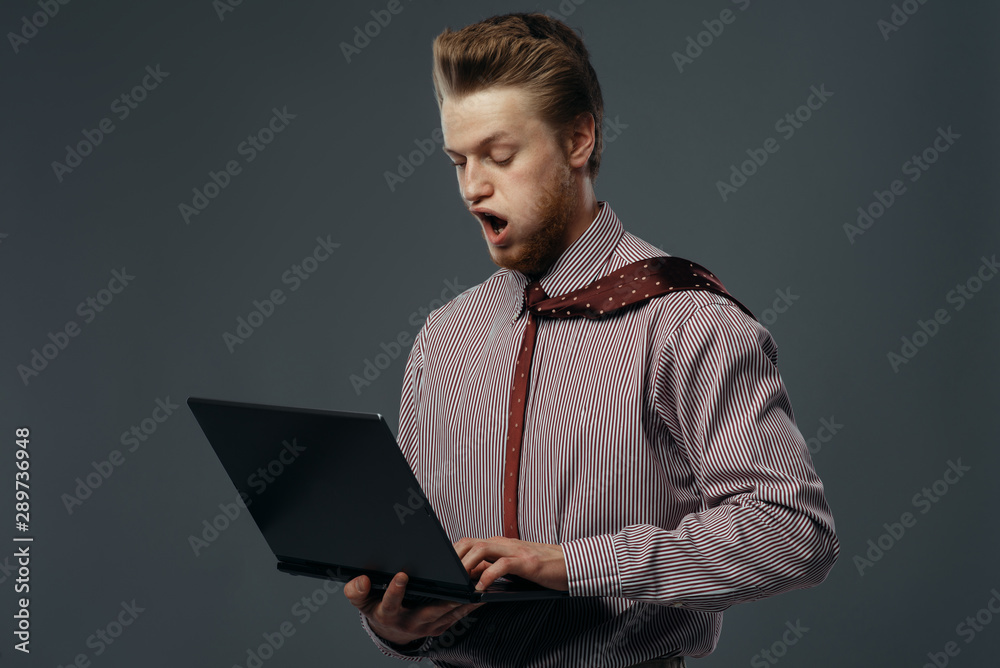 Strong wind blowing on man with laptop - obrazy, fototapety, plakaty 