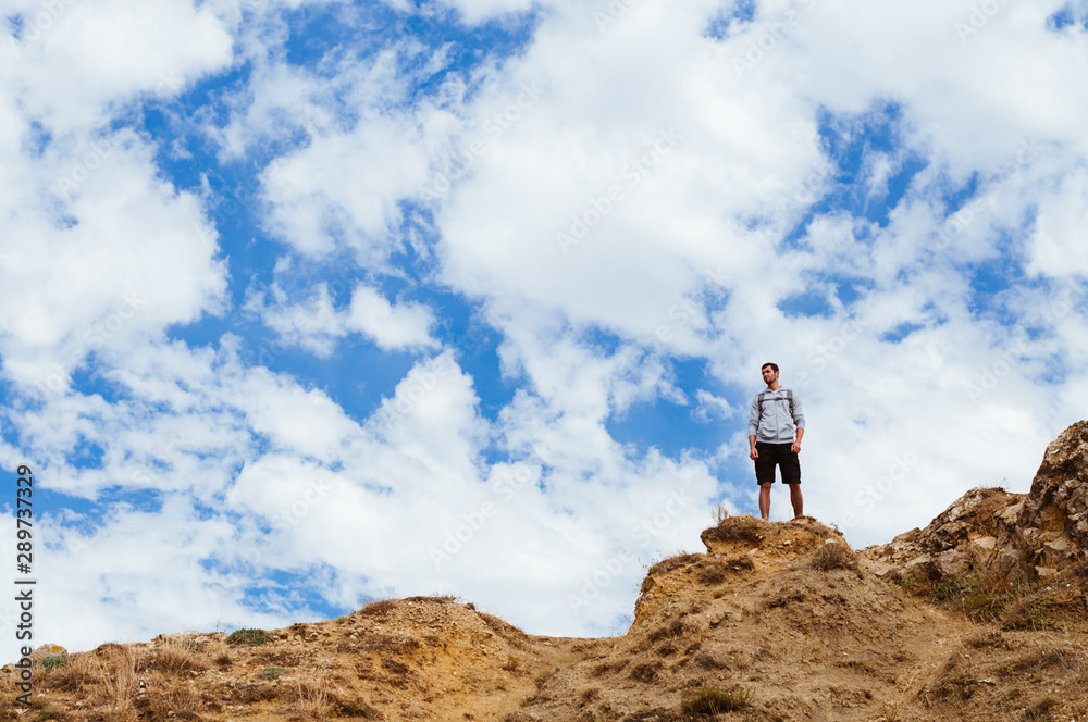 young man on top of the mountain young man on top of the mountain