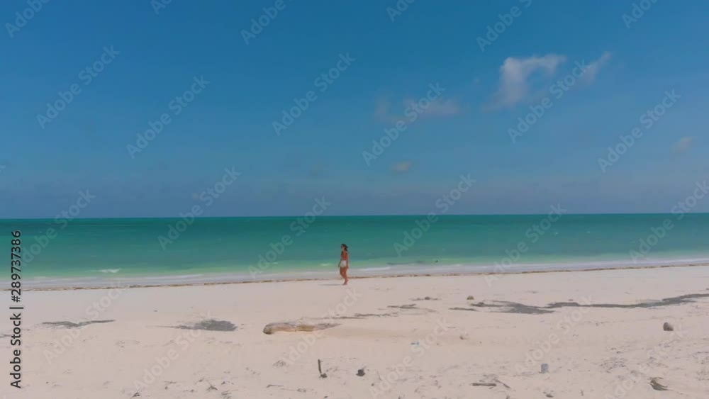 Punta Sebaring on Bugsuk Island from above. Aerial shot of woman walking Endless white sand beach surrounded by turquoise water at tropical green island in Balabac, Palawan, Philippines Punta Sebaring on Bugsuk Island from above. Aerial shot of woman walking Endless white sand beach surrounded by turquoise water at tropical green island in Balabac, Palawan, Philippines