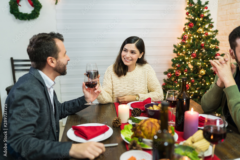 Happy Lovers Toasting Drinks At Home In Christmas Happy Lovers Toasting Drinks At Home In Christmas