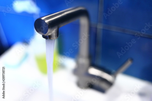 Washbasin tap with stainless steel waste