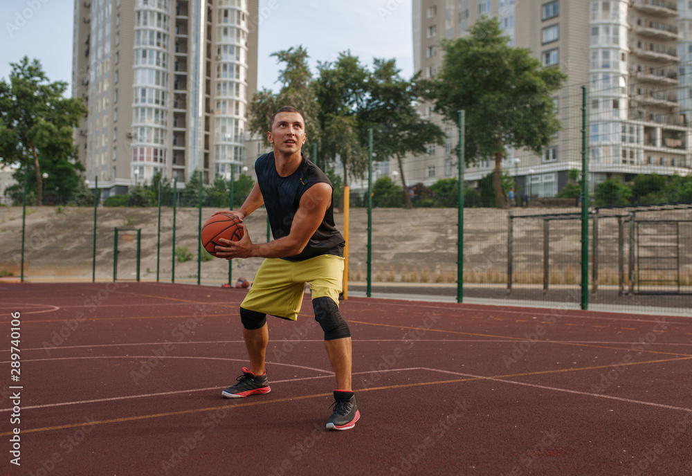 Basketball player prepares to make a shoot outdoor