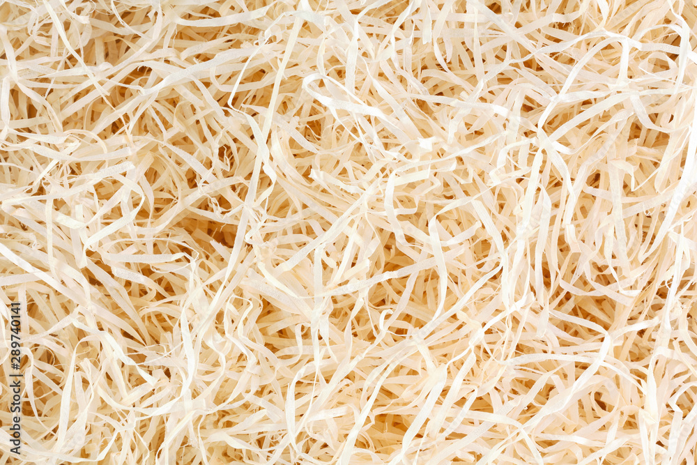 Wood background. Close-up of wooden shavings for packing.
