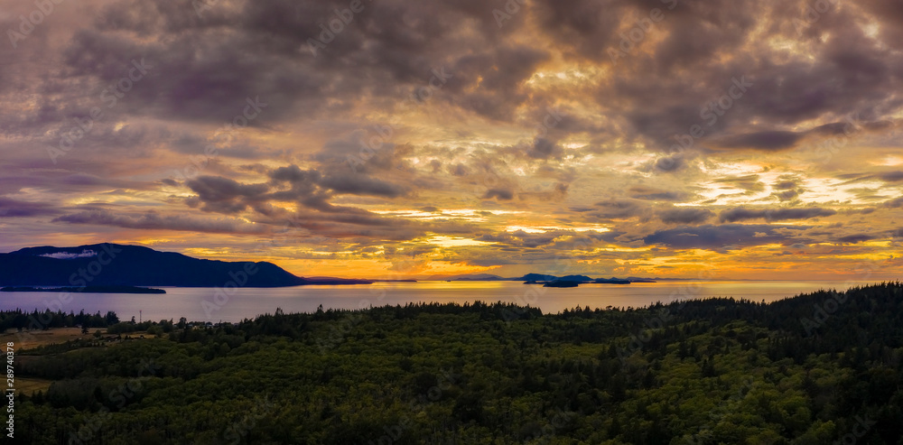 Panoramic View of the San Juan Islands of Puget Sound. Aerial shot of Orcas Island and Matia Island as seen from Lummi Island during a glorious and dramatic sunset in the Salish Sea.