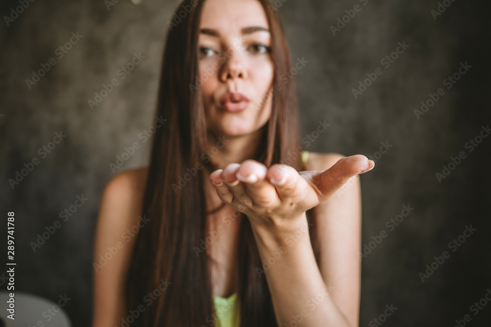 Fototapeta premium Brunette girl on seom fne smiling, vintage tinted